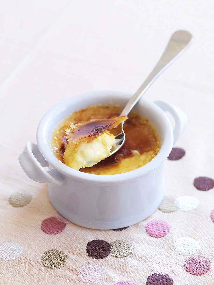 Crème brûlée with spoon