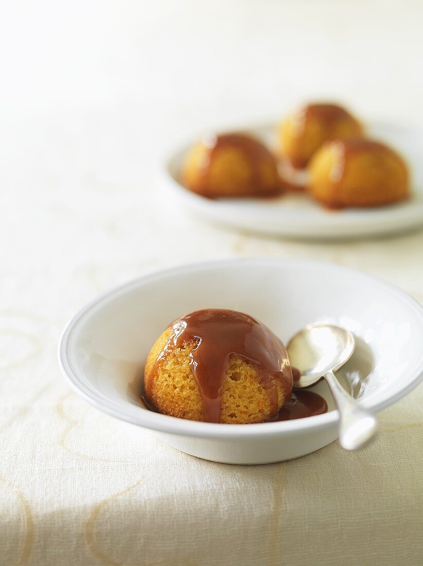 Baked orange pudding with caramel sauce