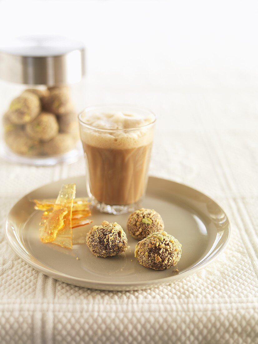 Chocolate truffles and a glass of milky coffee