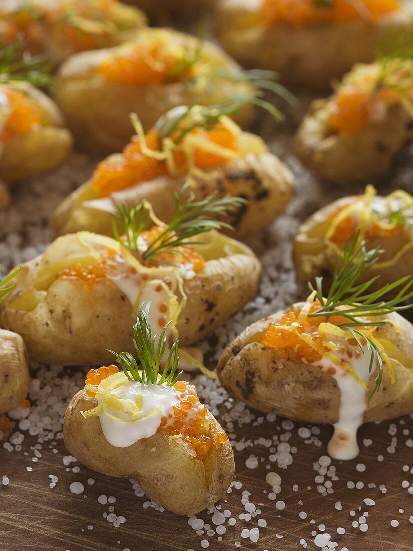 Potatoes baked in salt with sour cream and caviar