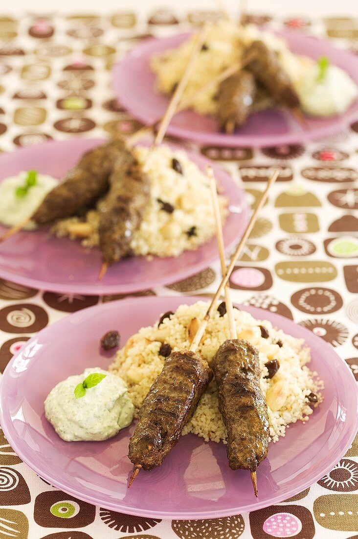 Lamb kebabs on couscous with minted yoghurt