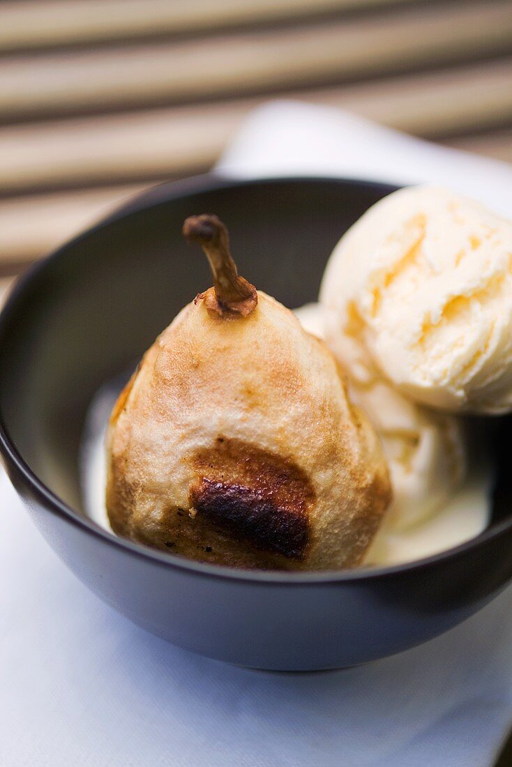 Baked pear with vanilla ice cream