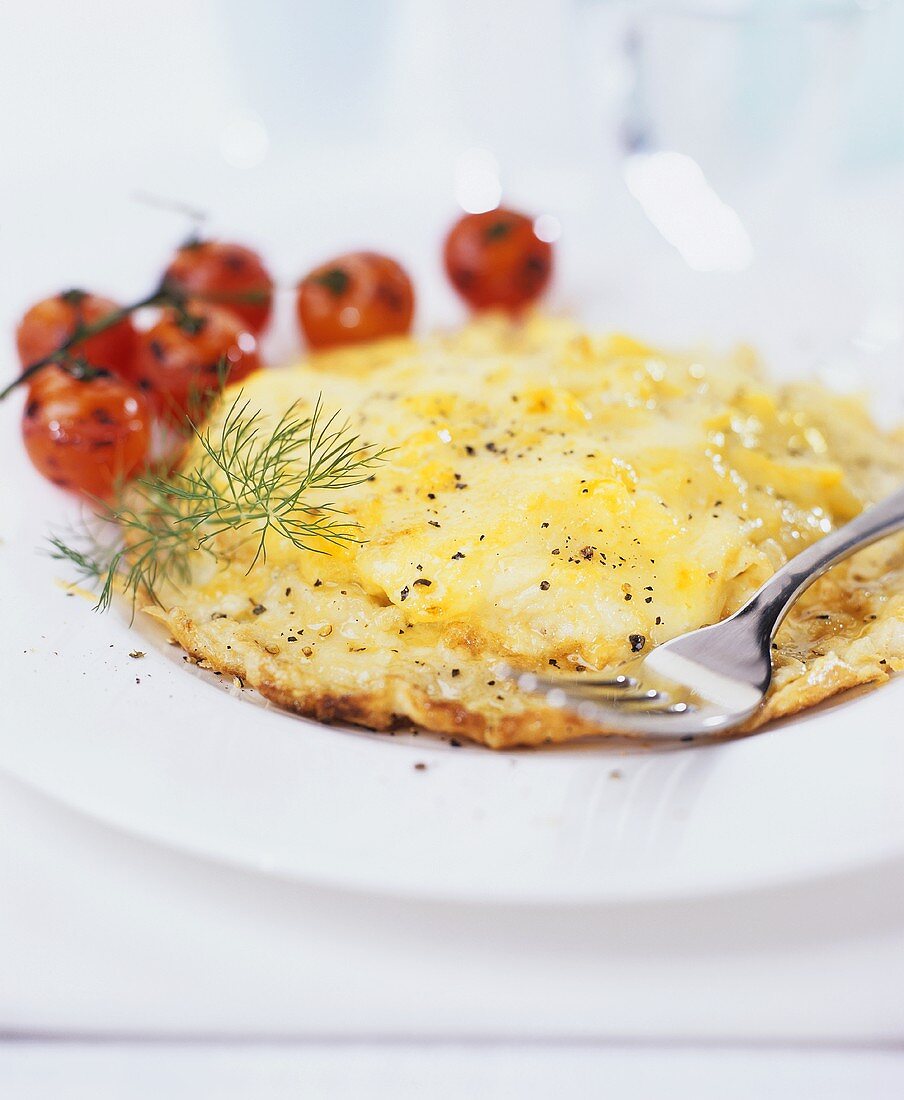 Cheese pancake with cocktail tomatoes