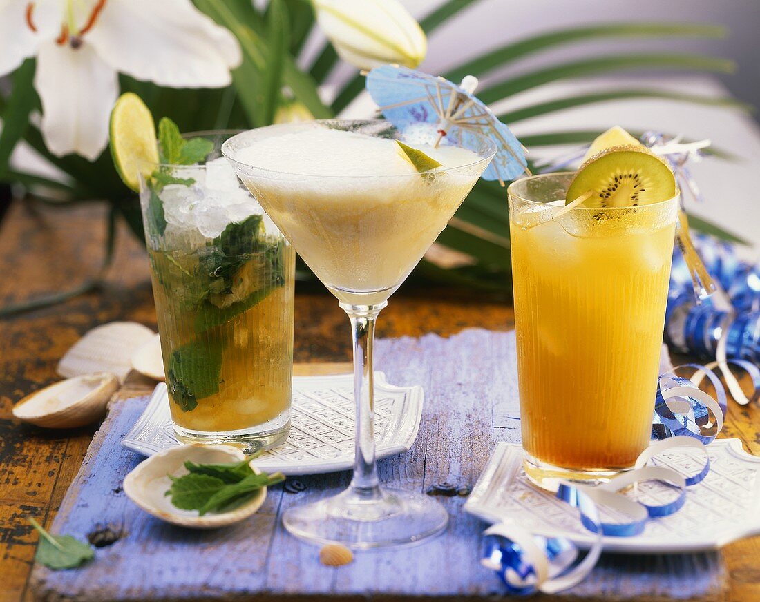 Mojito, mango and coconut cocktail and pineapple drink
