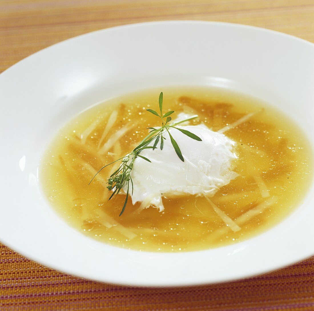 Sherry consommé with julienne vegetables and poached egg
