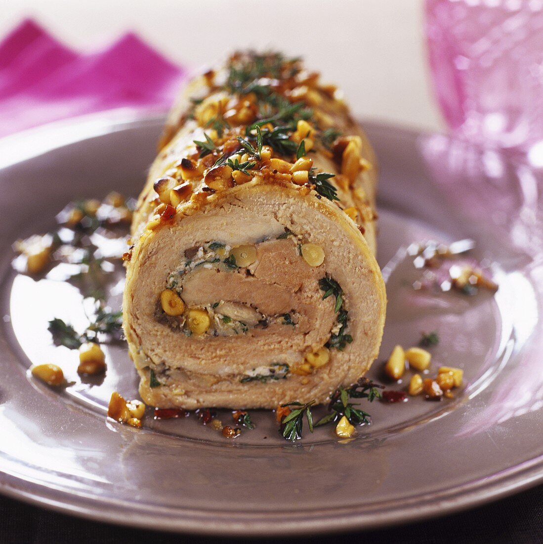 Rolled pork roast with herbs and pine nuts