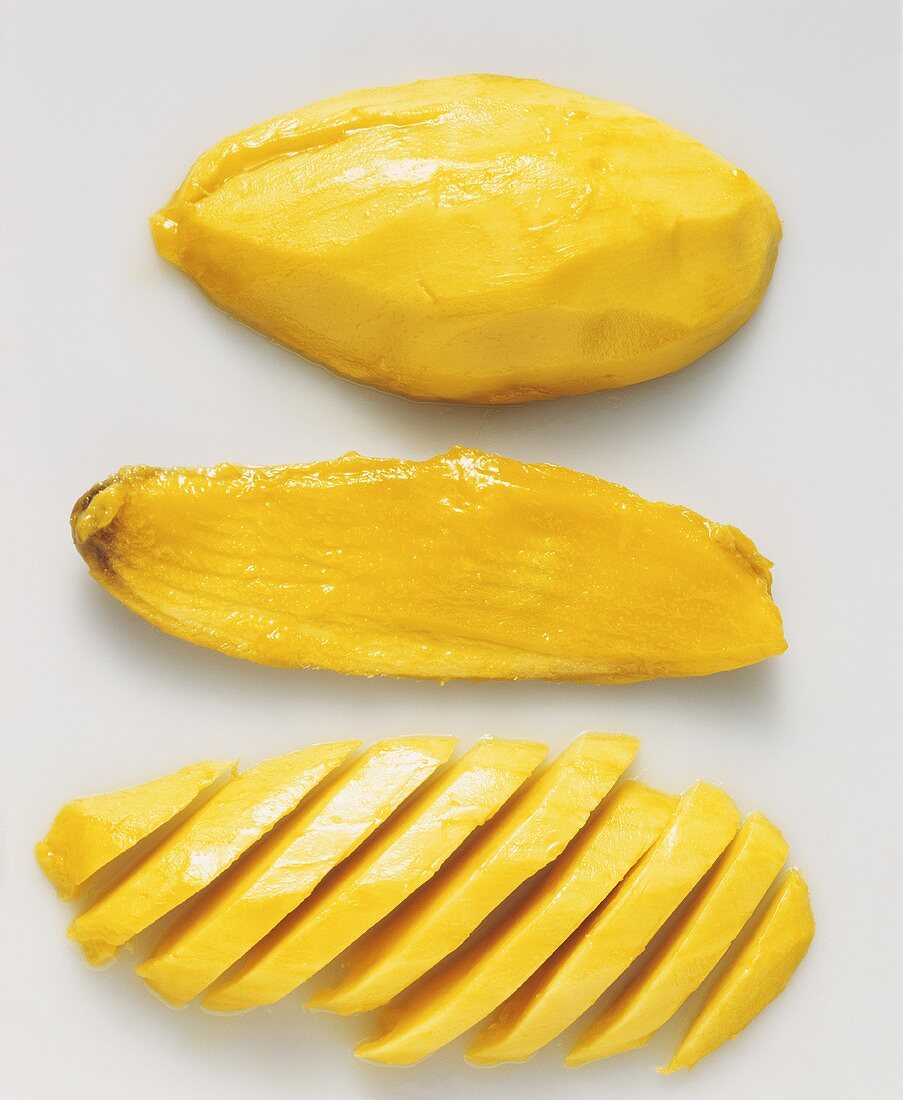 Peeled mango and mango stone