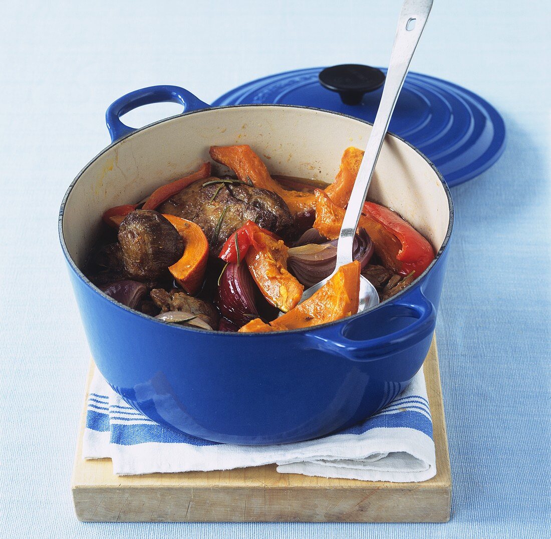 Lamb and pumpkin stew with peppers and red onions