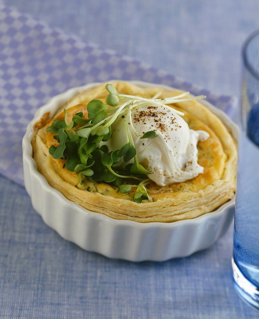 Individual quiche topped with poached egg