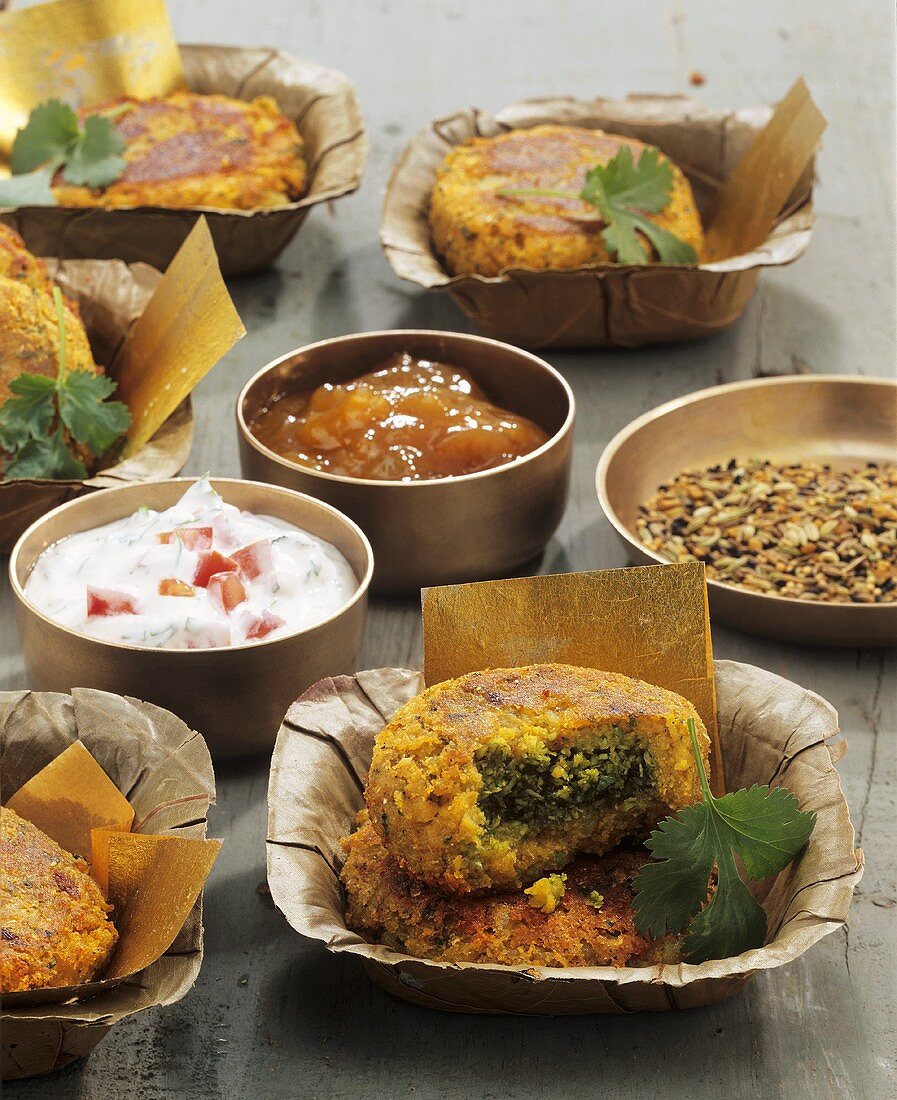 Aloo tikki (Indian potato cakes) with chutney and dip