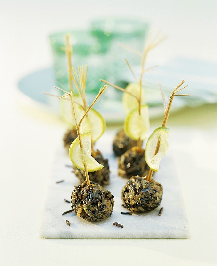 Wild rice balls with lime slices