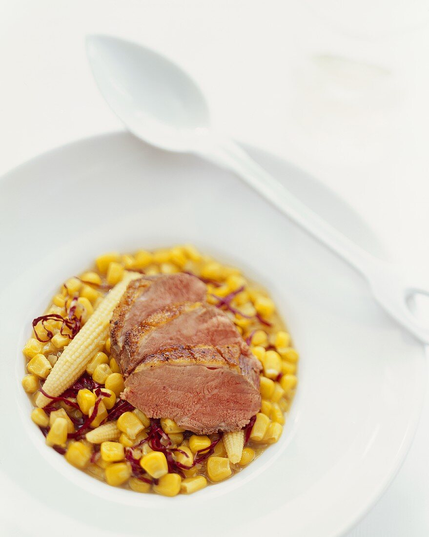 Roast duck breast on caramelised sweetcorn with red cicorino