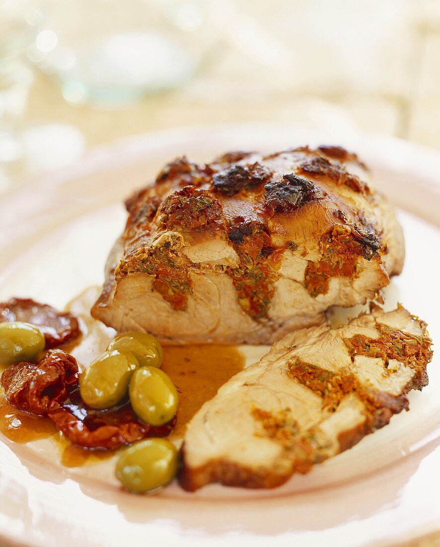 Roast pork stuffed with dried tomatoes and olives