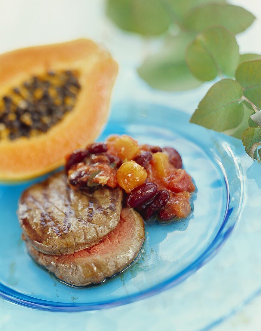 Beef medallion with papaya and bean chilli