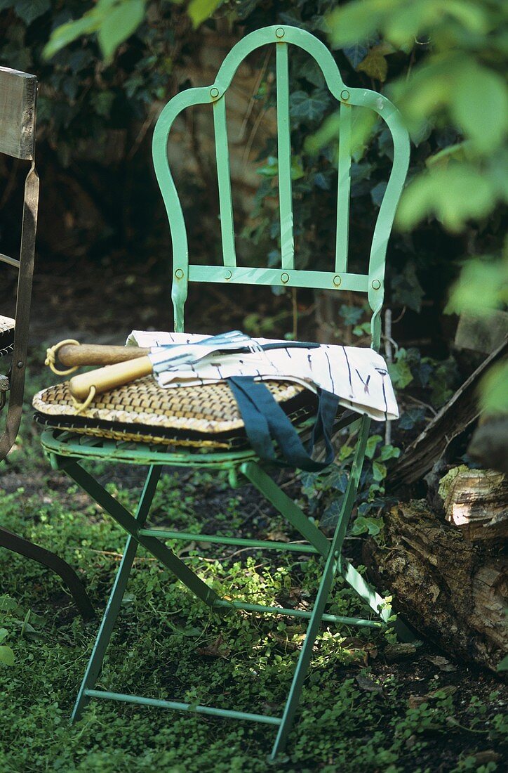 Garden chair with garden tools