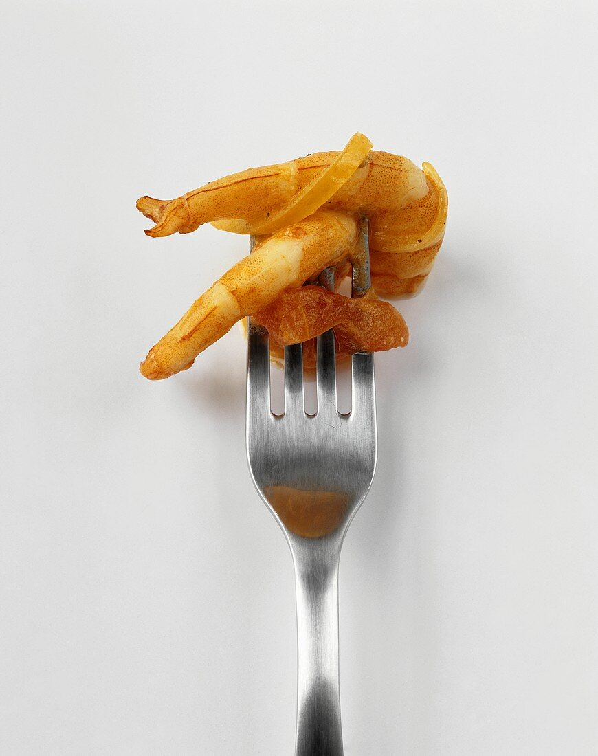 Cooked prawns on a fork