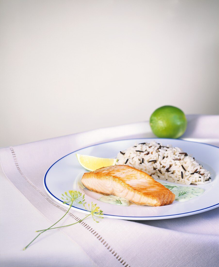 Salmon fillet with dill sauce and rice
