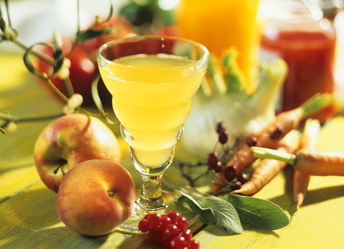 Still life with fruit juice, fruit and vegetables