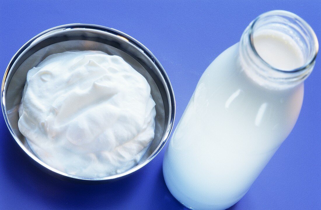 Whipped cream and unwhipped cream in bottle