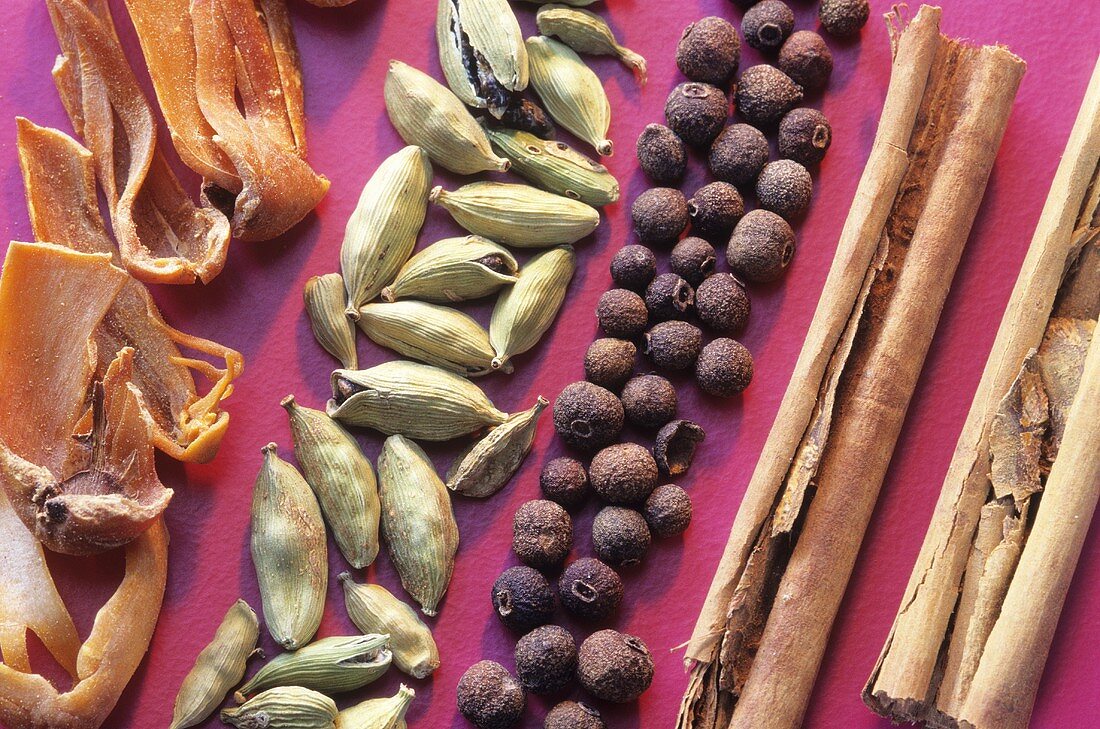 Mace, cardamom pods, allspice berries and cinnamon sticks