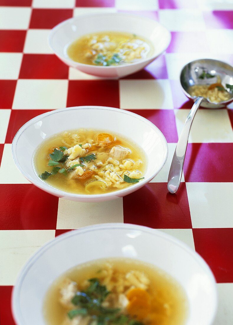 Chicken broth with grated pasta and lovage