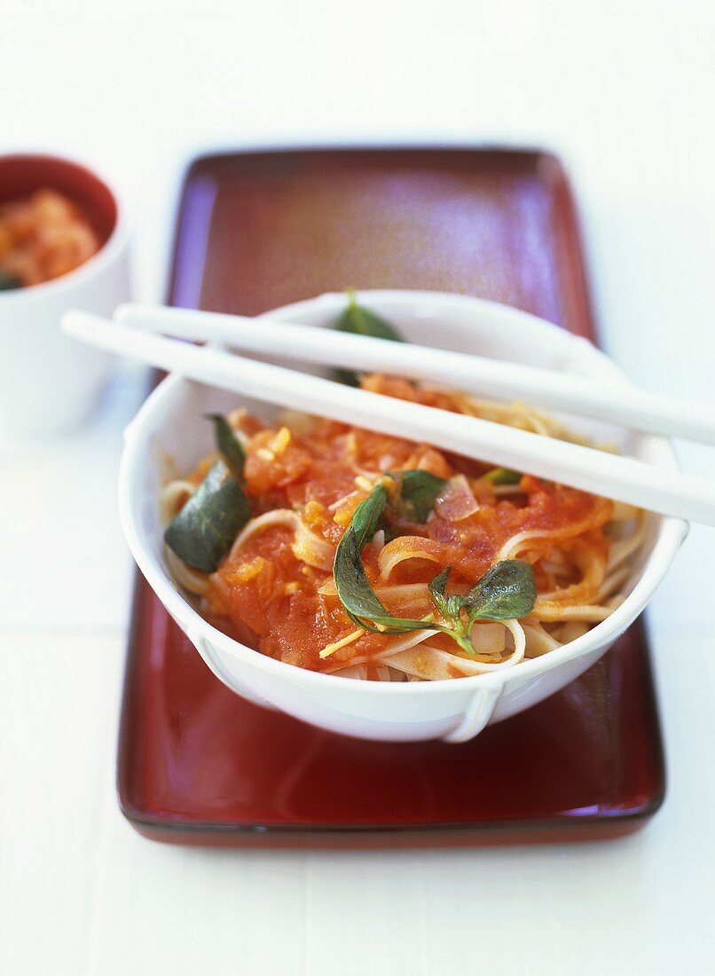 Ribbon noodles with tomato sauce and basil