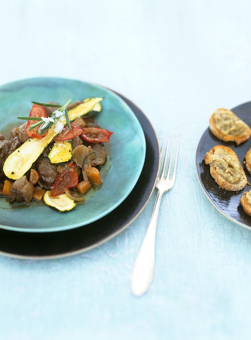 Shoulder of lamb with courgettes, tomatoes and aubergine caviar