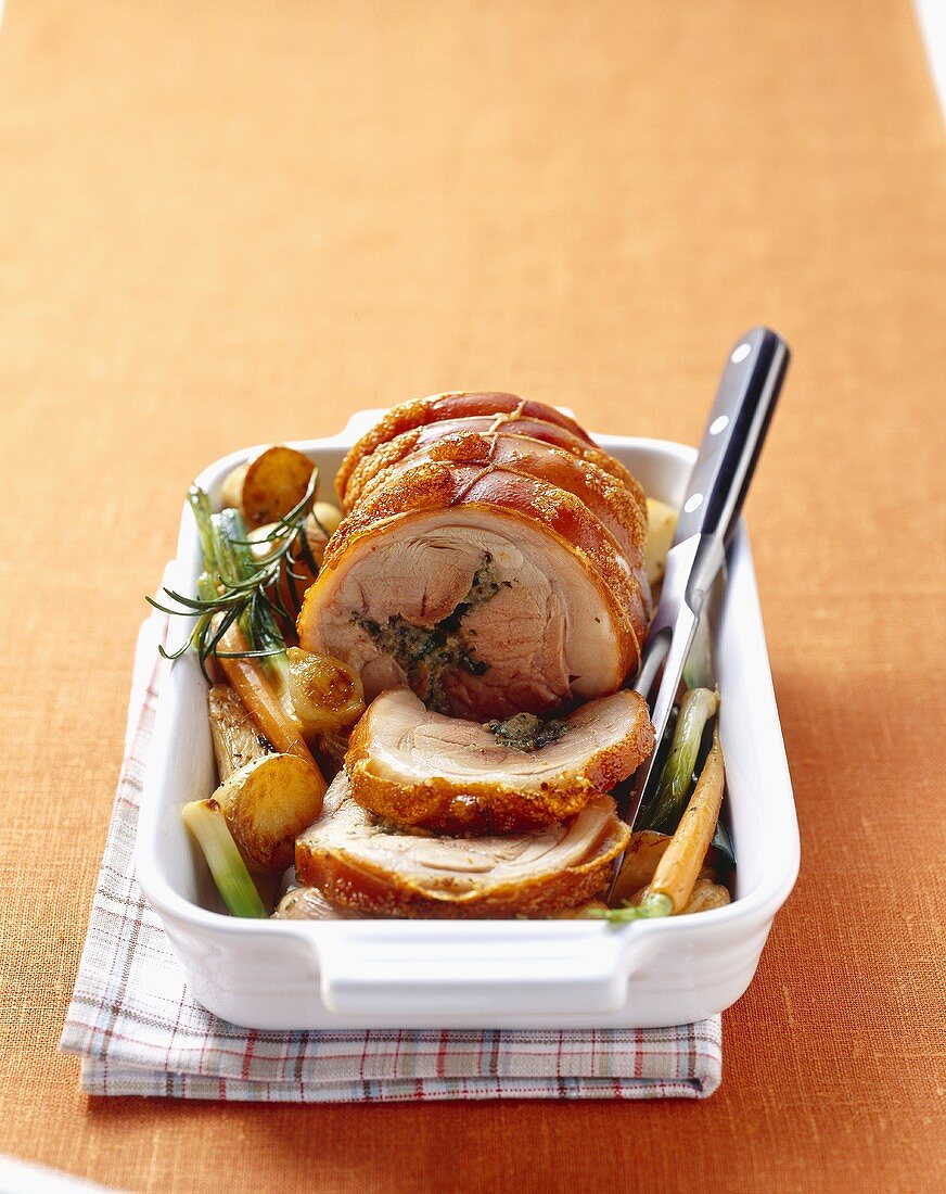 Stuffed loin of pork with roasted vegetables