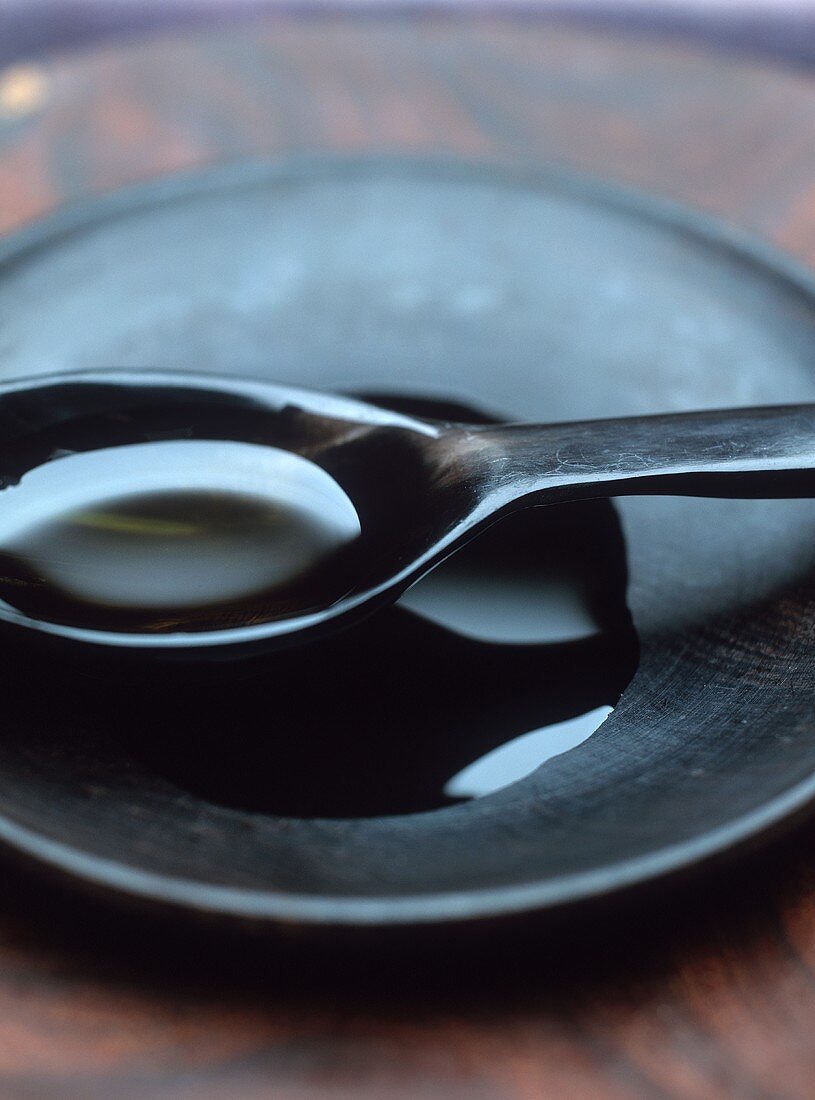 Olive oil in wooden spoon