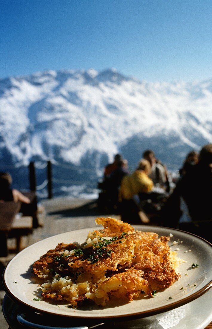 Potato rösti (fried potato cakes) served outside a mountain hut