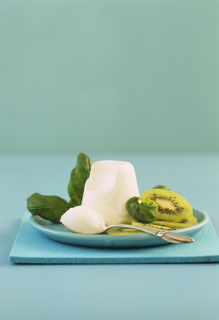 Panna cotta with kiwi and basil