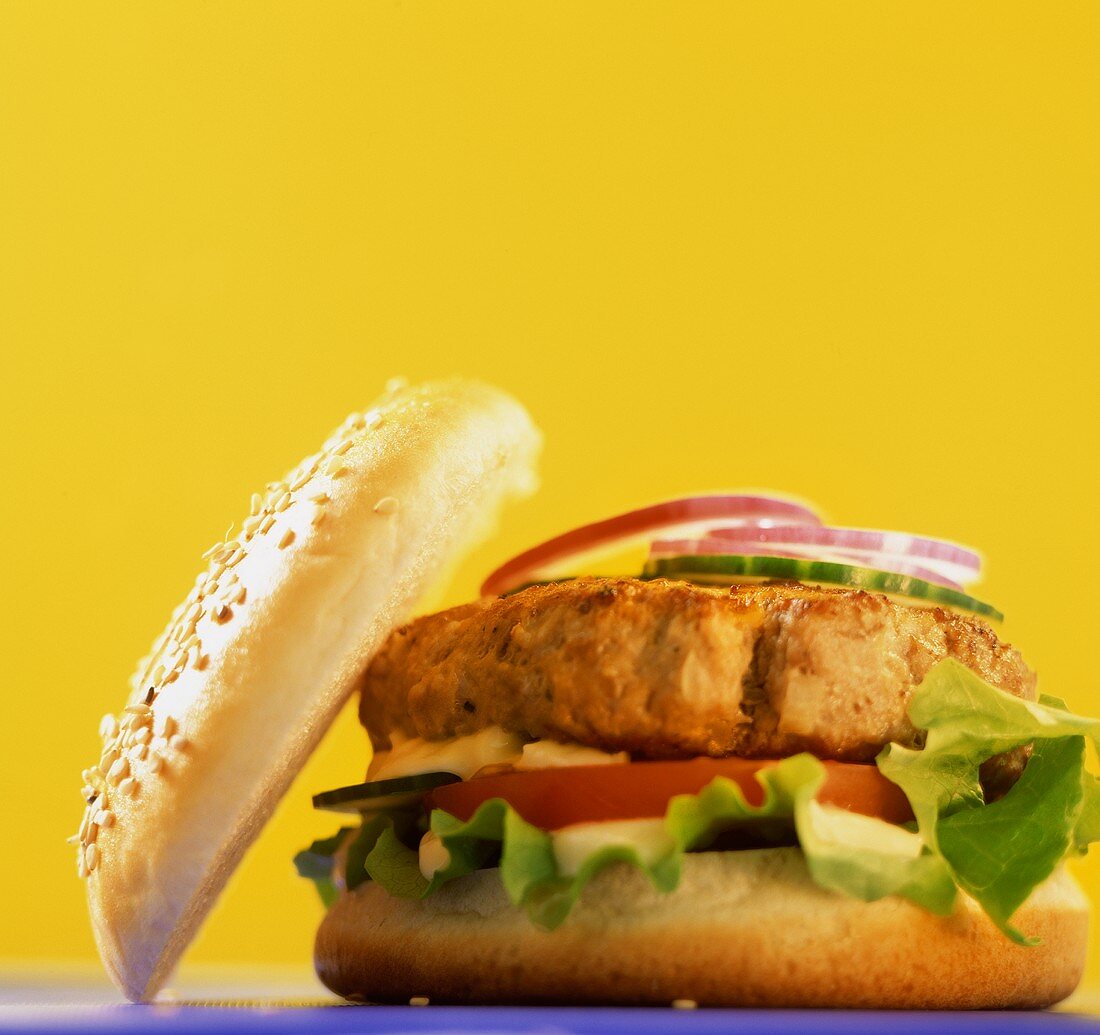 Hamburger in front of a yellow background