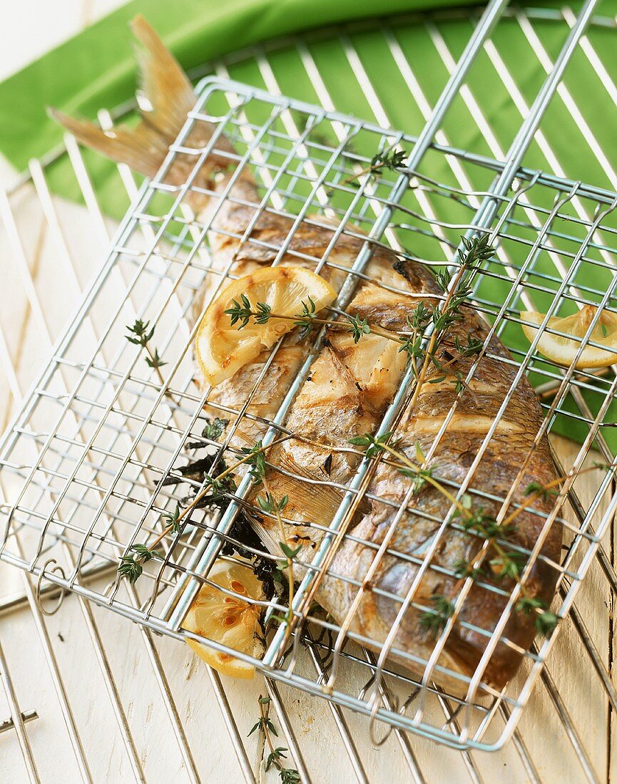 Grilled bream in a fish basket