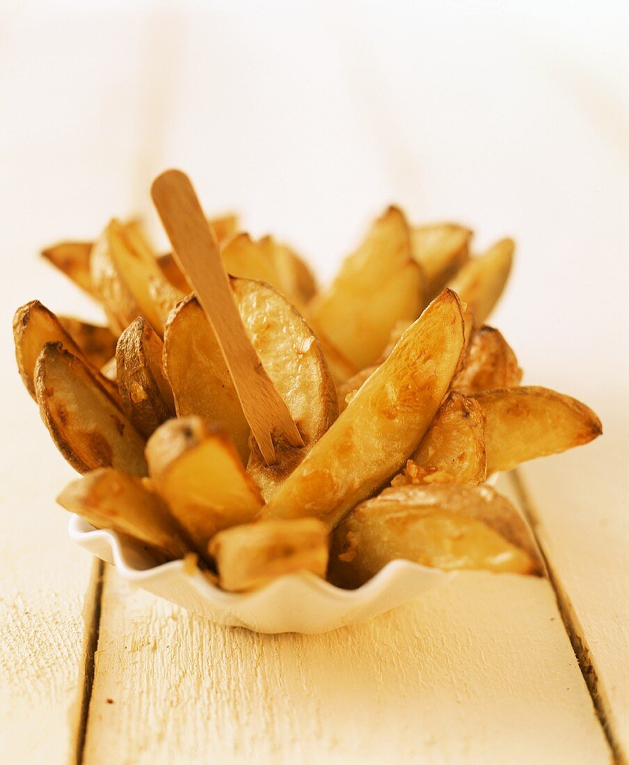 Frittierte Kartoffelspalten