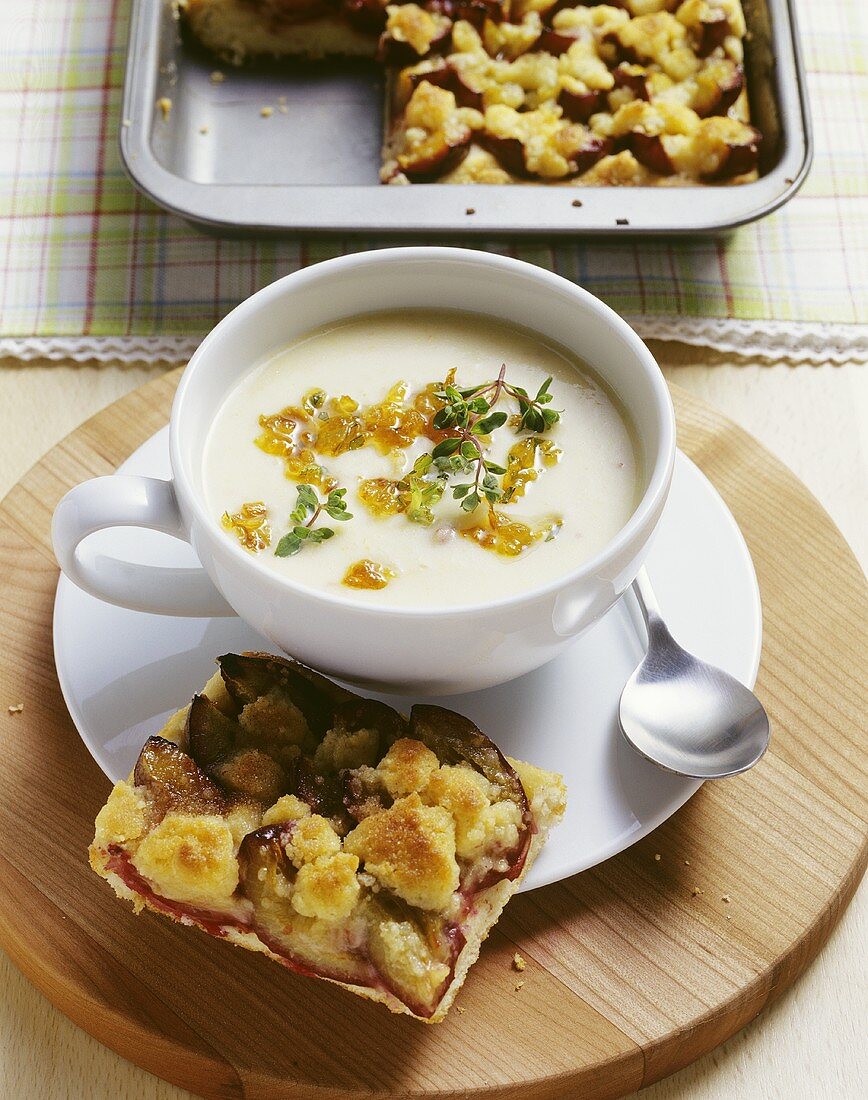 French potato soup with onions and a slice of damson cake