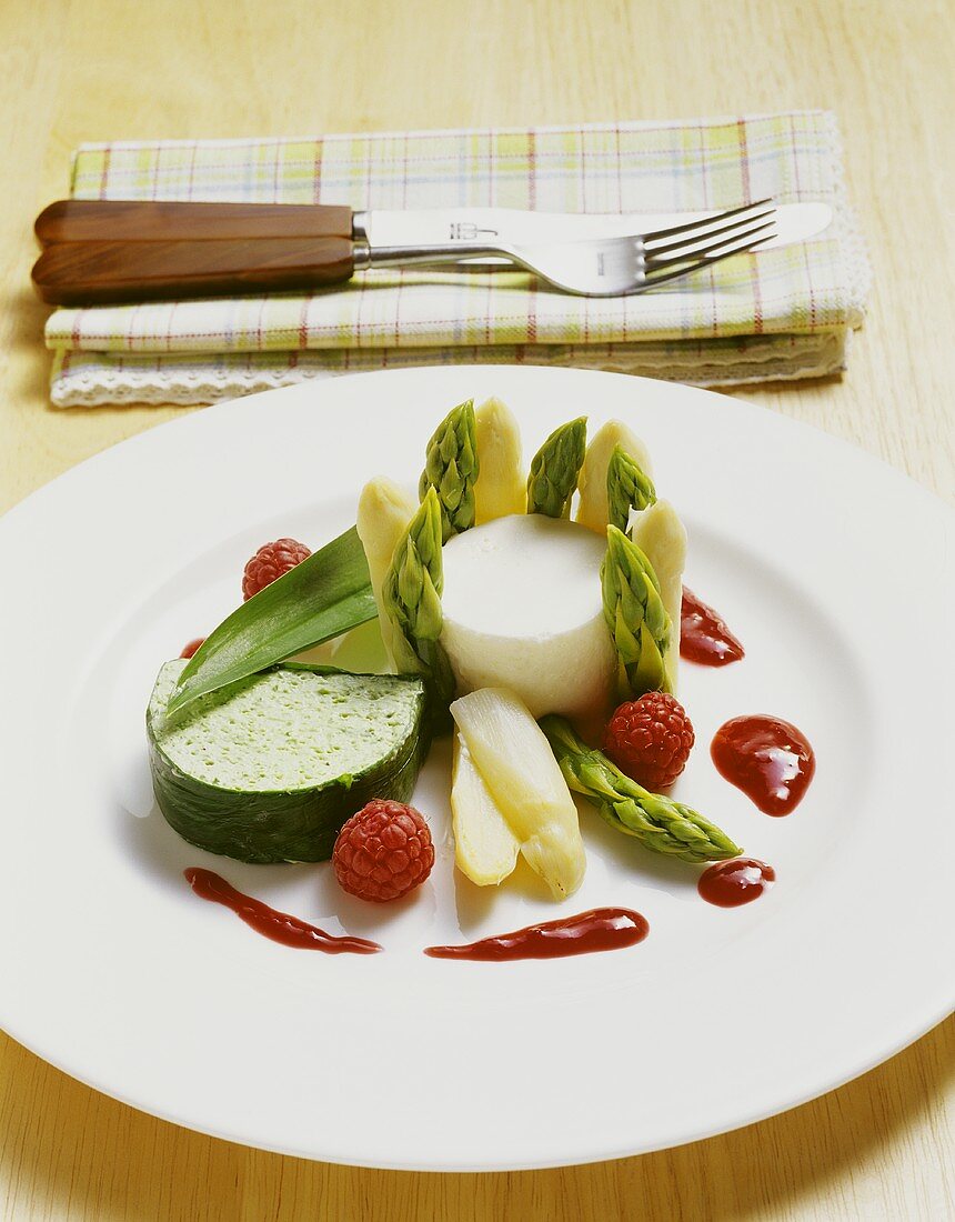 Asparagus mousse and chive terrine with raspberry sauce.