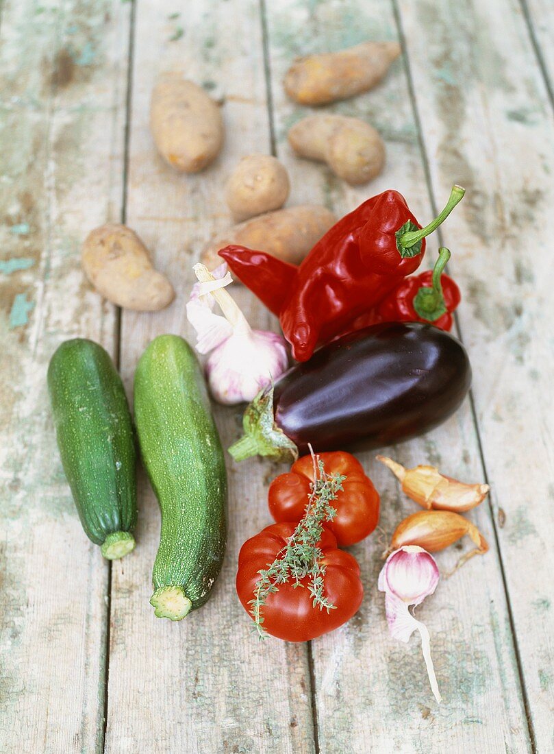 Potatoes, peppers, an aubergine, courgettes, tomatoes and garlic