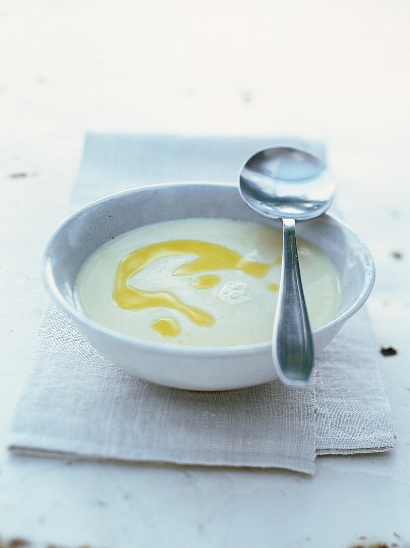 White cream of bean soup drizzled with olive oil