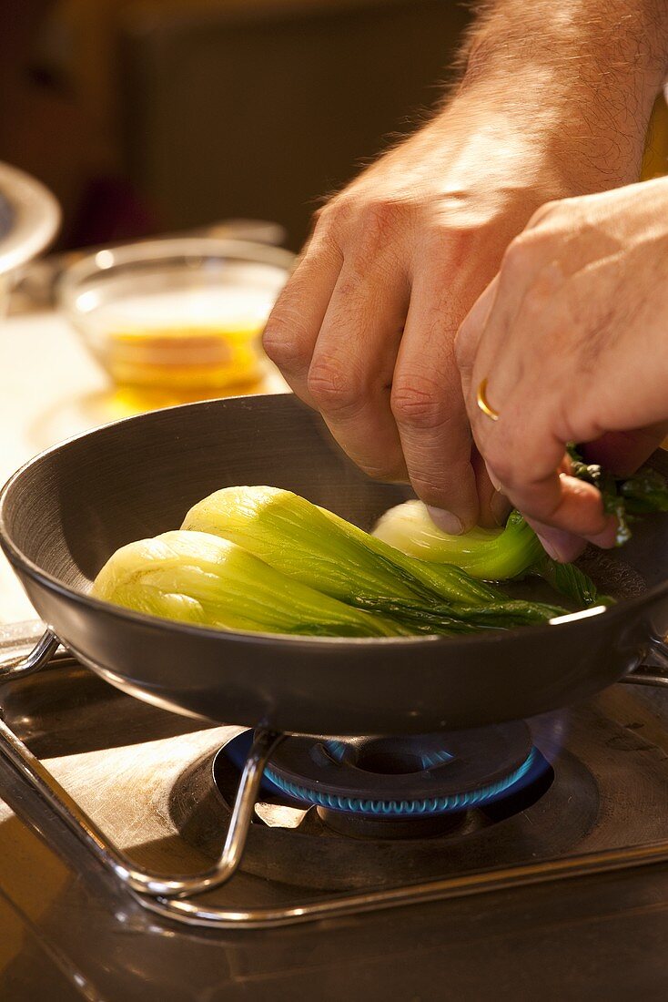 Bok choy being fried