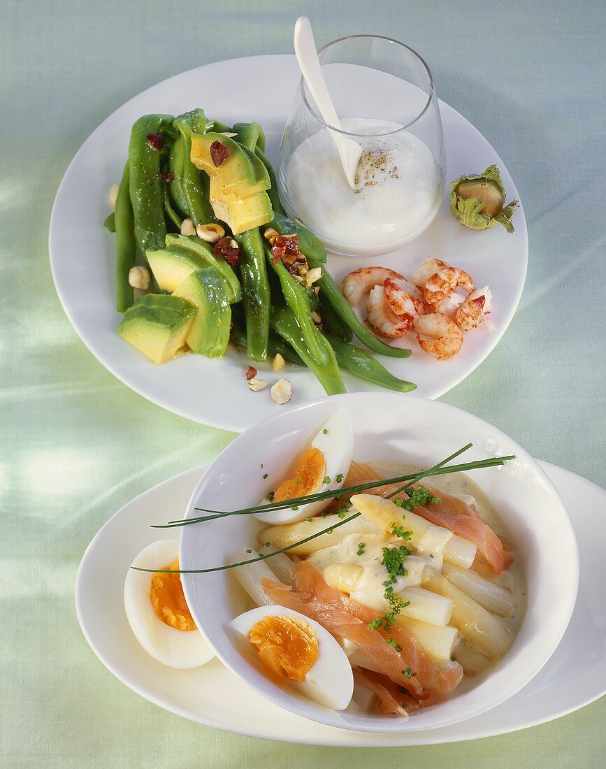 Bean salad with avocado and cray fish and an asparagus salad with smoked salmon