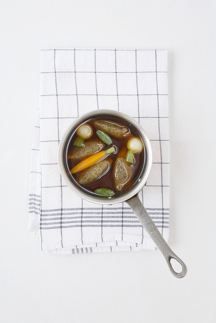 Chicken stock with liver dumplings and root vegetables