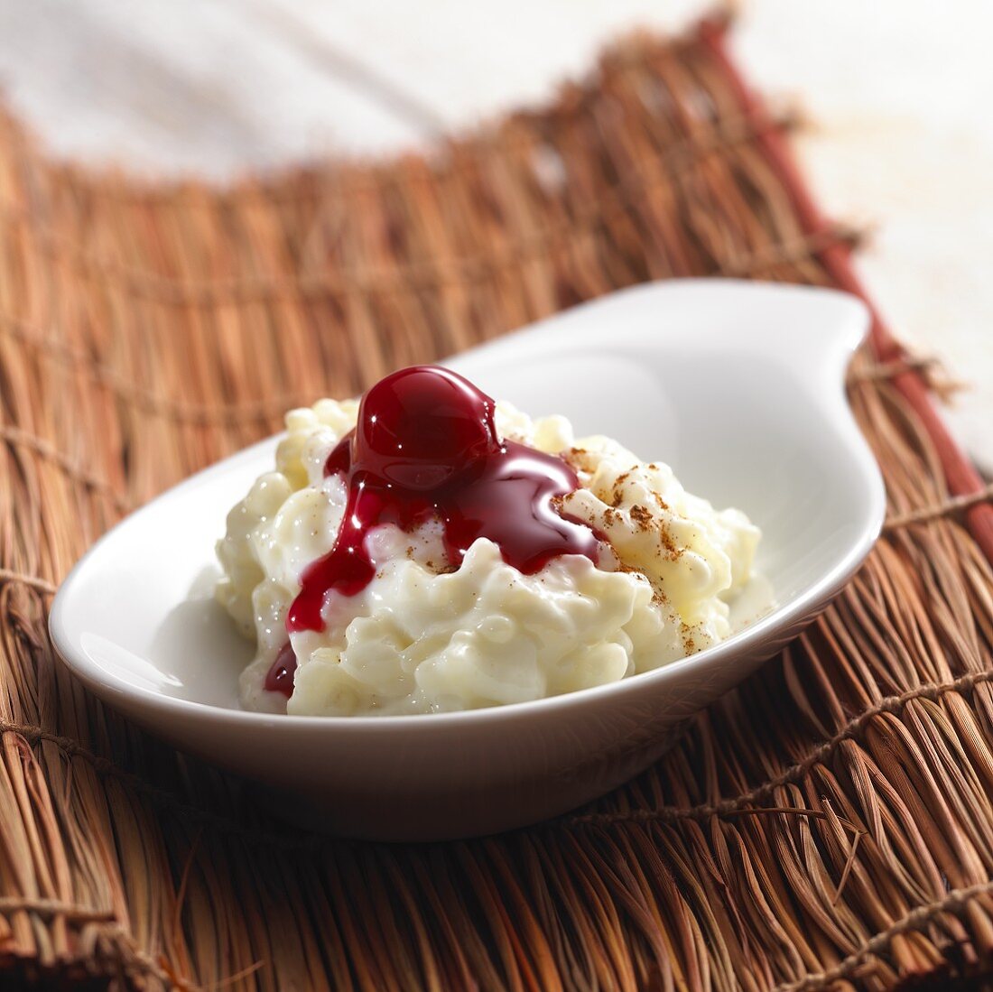 Rice pudding with cherry compote and cinnamon