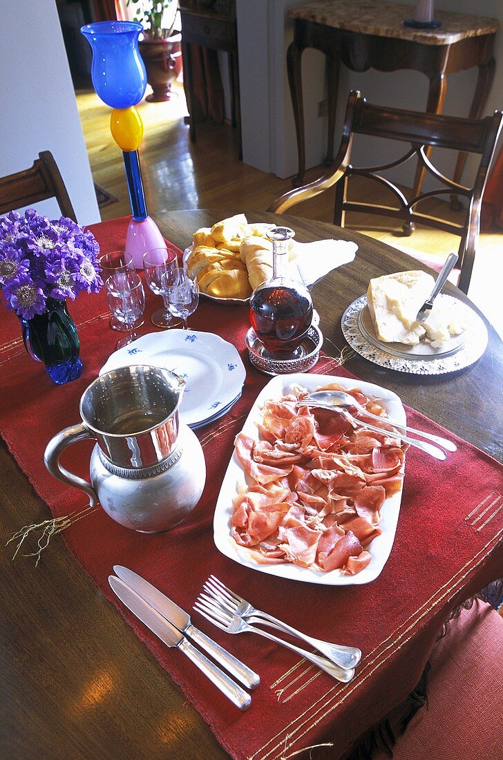 Supper on a wooden table with a red table runner