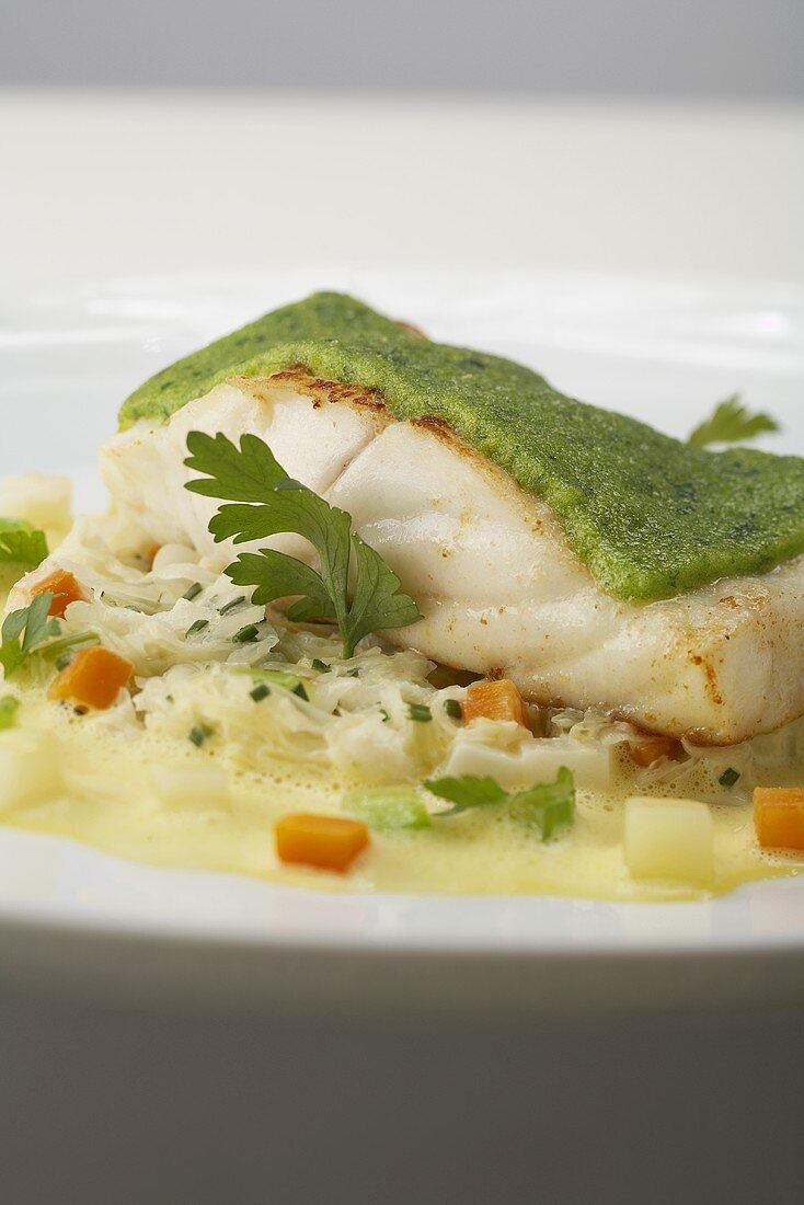 Brill fillet with a parsley crust on creamy vegetables