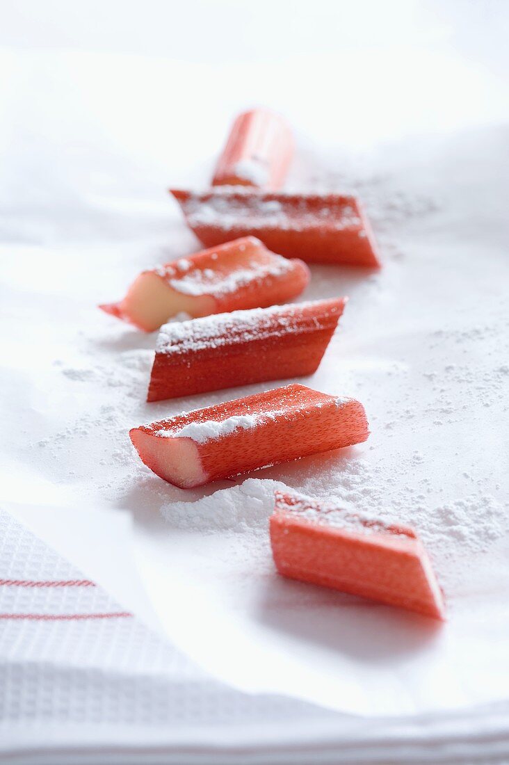 Pieces of rhubarb with icing sugar