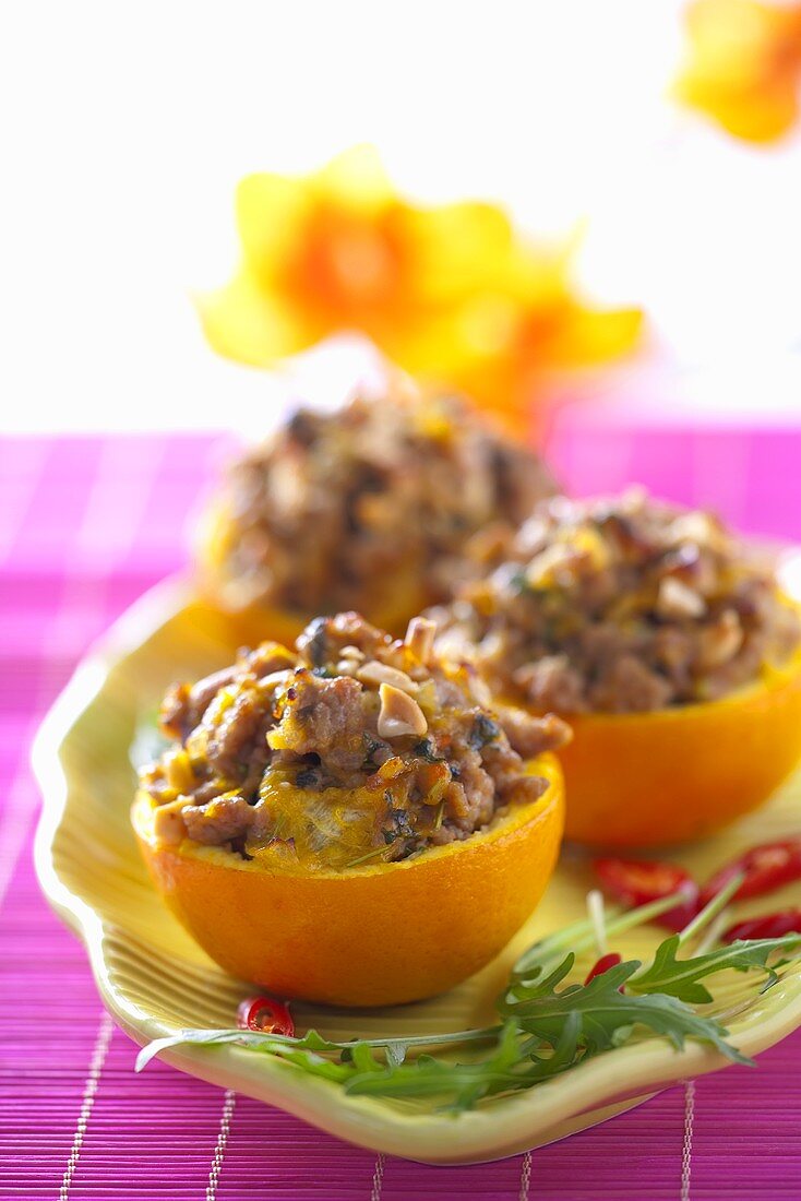 Oranges filled with minced meat and mushrooms