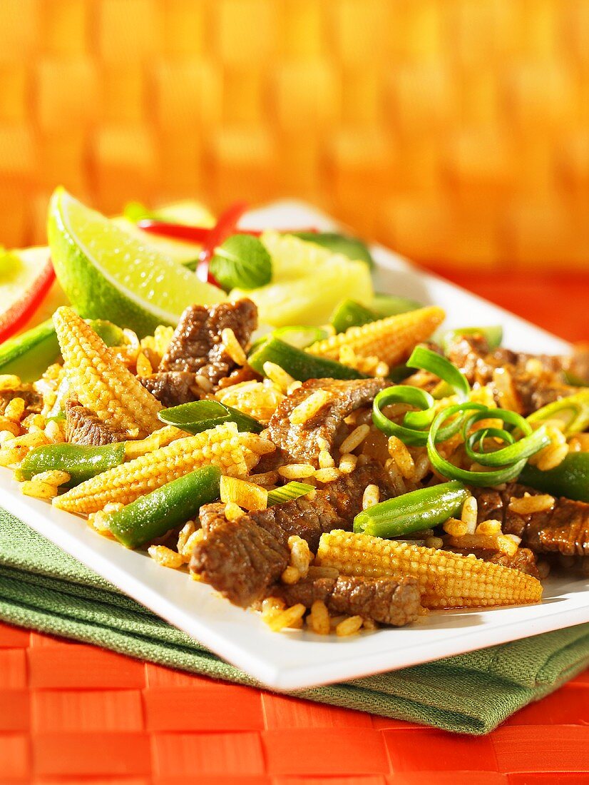 Red beef curry with corn cobs and rice (Asia)