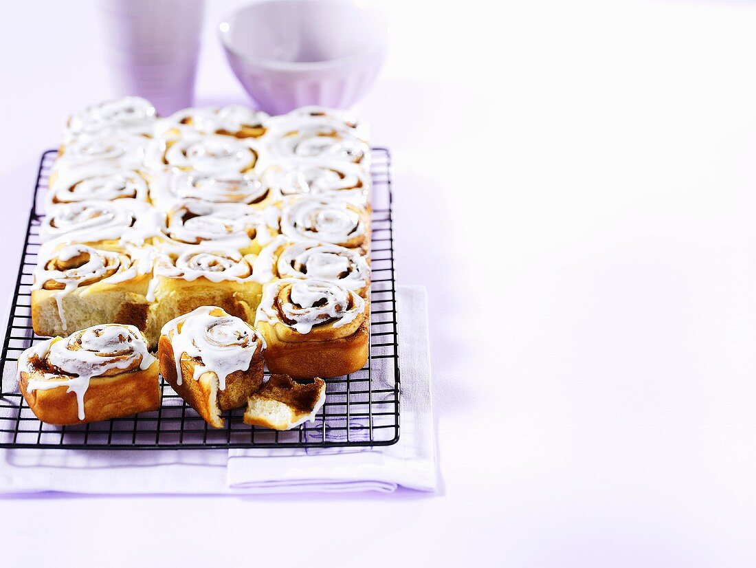 Chelsea buns on a wire rack