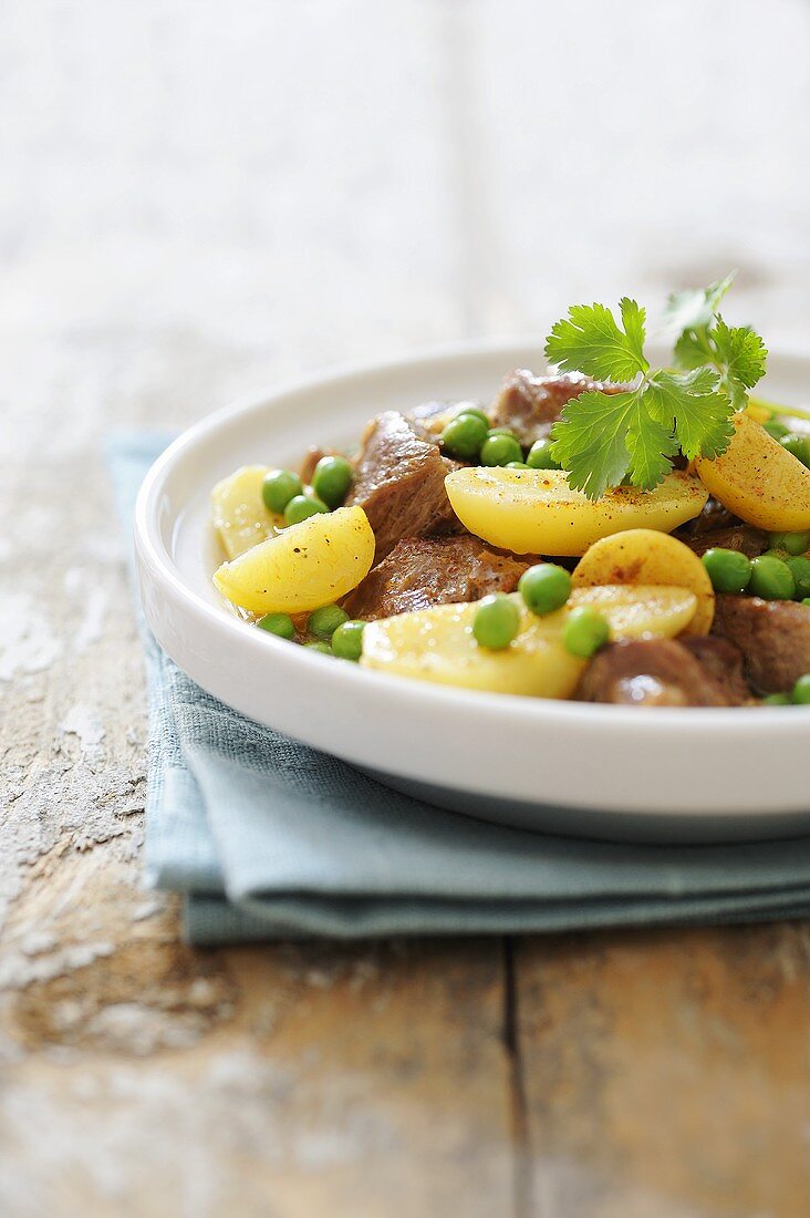 Lamb tagine with preserved lemons, potatoes and peas