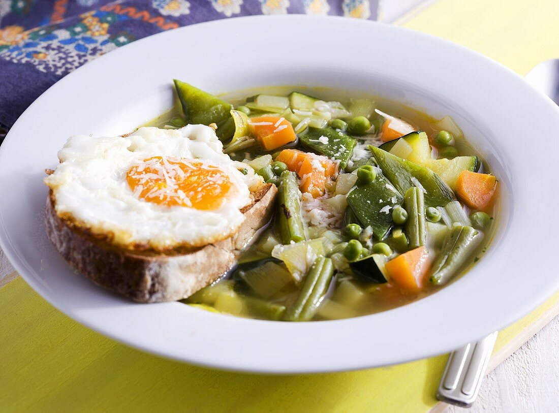 Minestrone with bread and fried egg